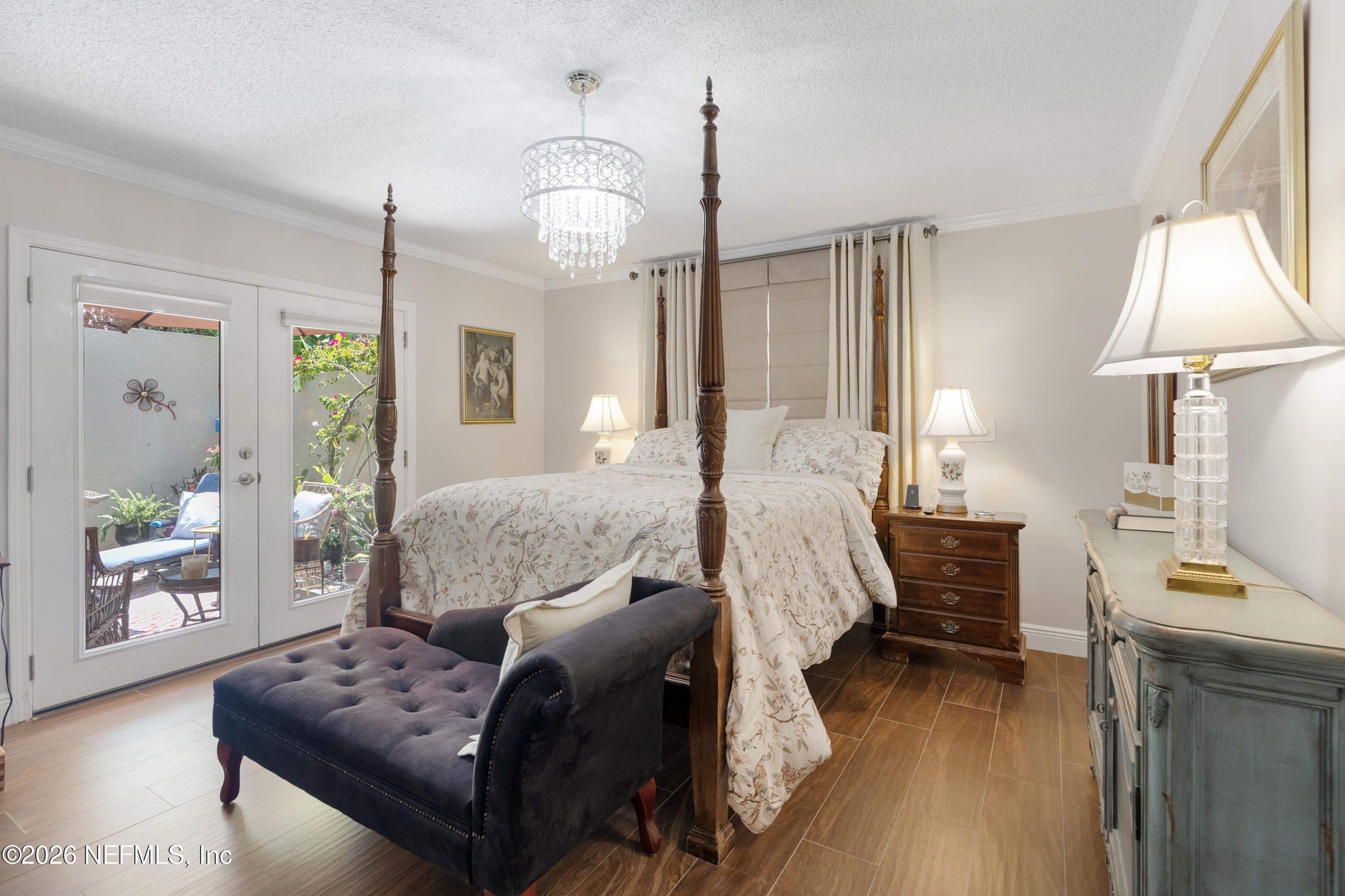 204 Gerado Street, Unit 3 St. Augustine, FL 32080 - Photo 16 of 31 a living room with furniture and a chandelier