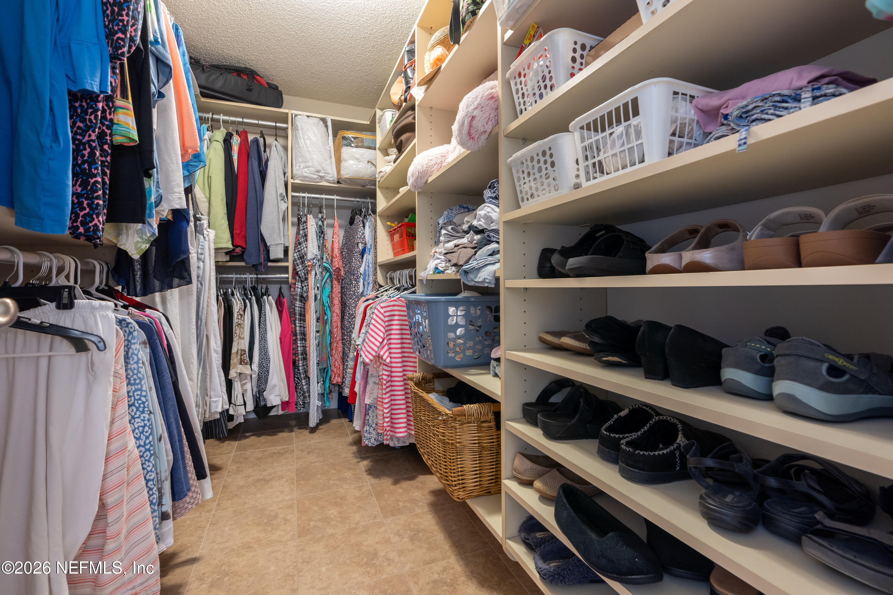 204 Gerado Street, Unit 3 St. Augustine, FL 32080 - Photo 21 of 31 a view of walk in closet with clothes and shoes