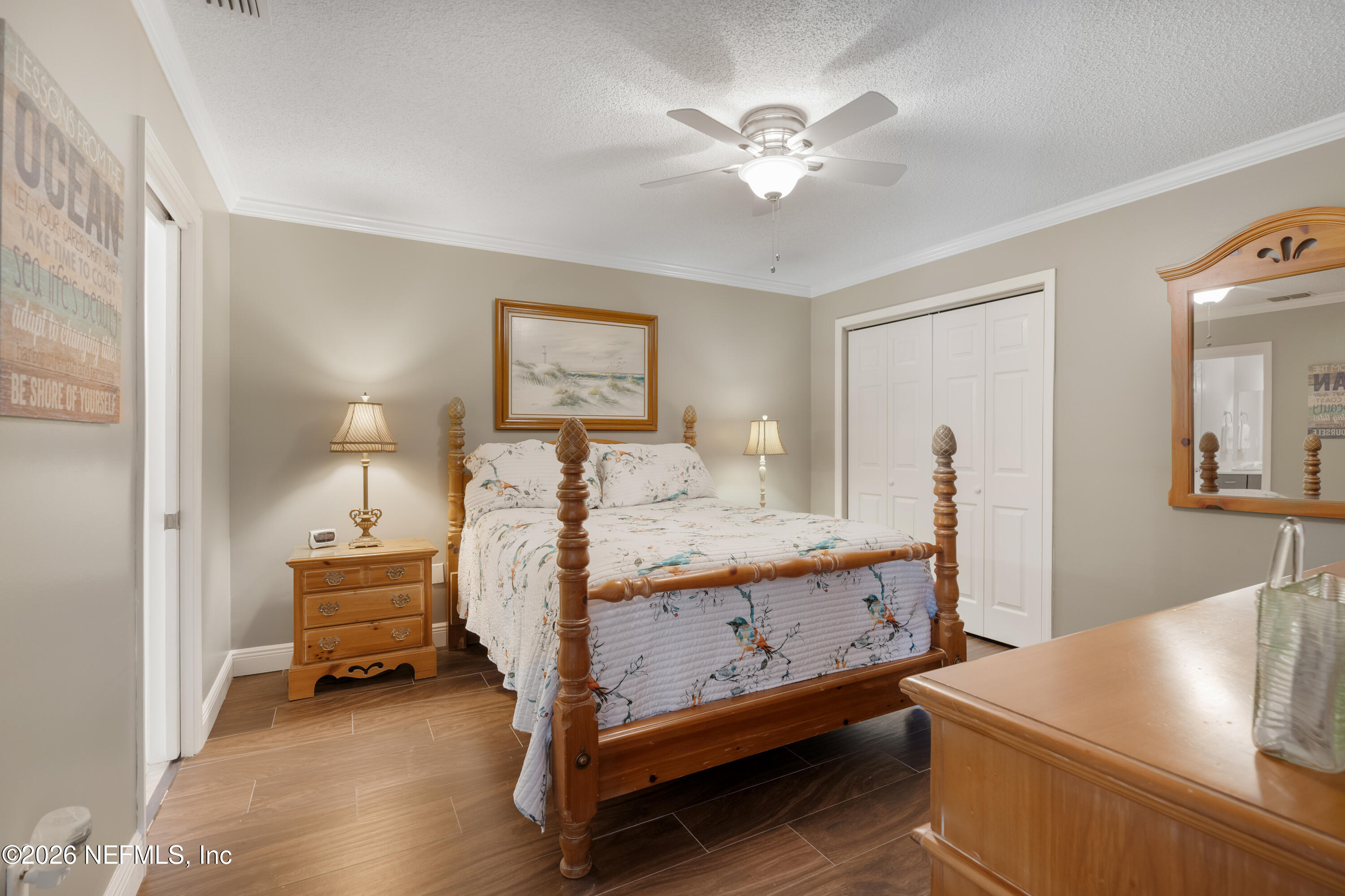 204 Gerado Street, Unit 3 St. Augustine, FL 32080 - Photo 22 of 31 a bedroom with a bed and a chandelier