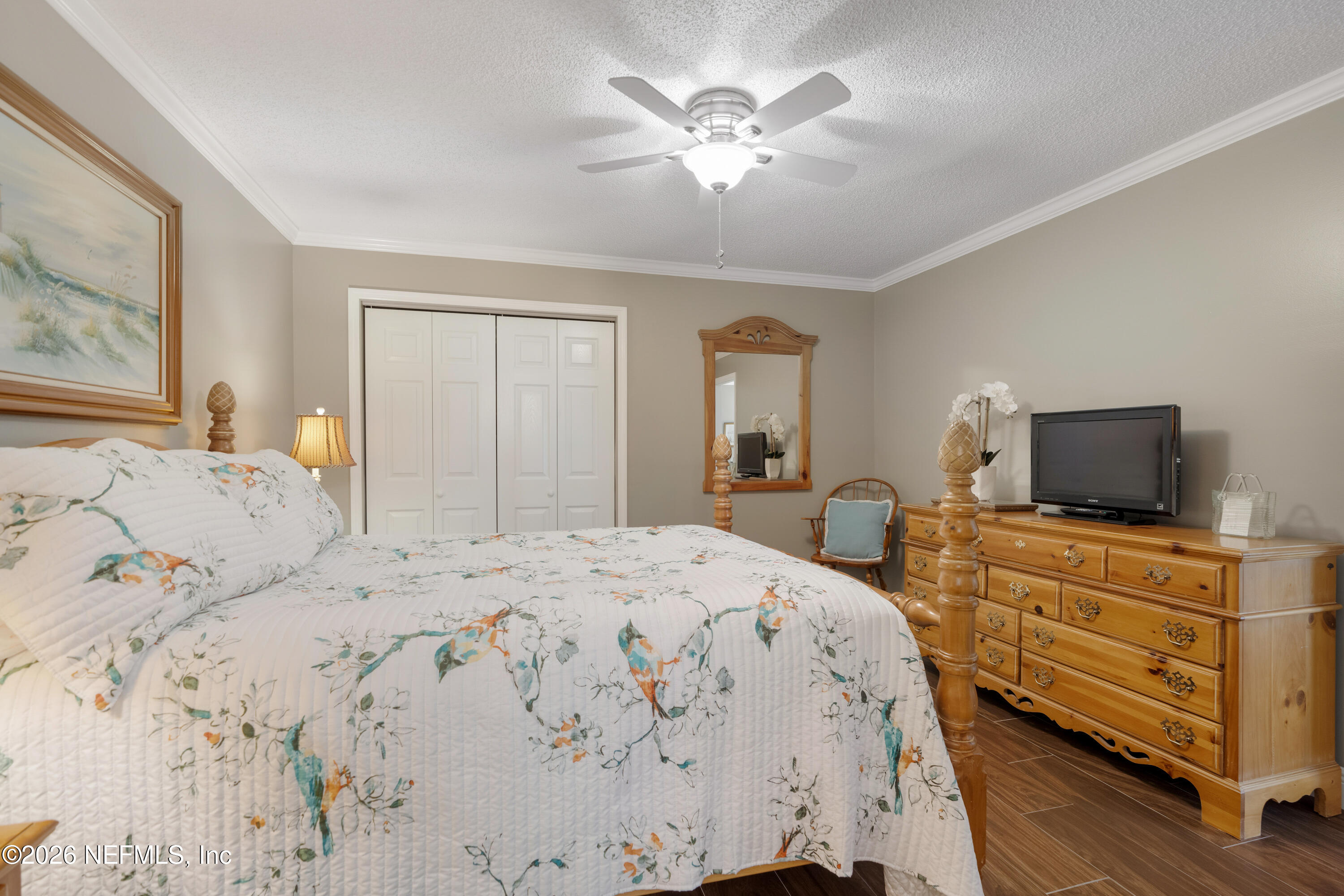 204 Gerado Street, Unit 3 St. Augustine, FL 32080 - Photo 23 of 31 a bedroom with a bed and a flat screen tv