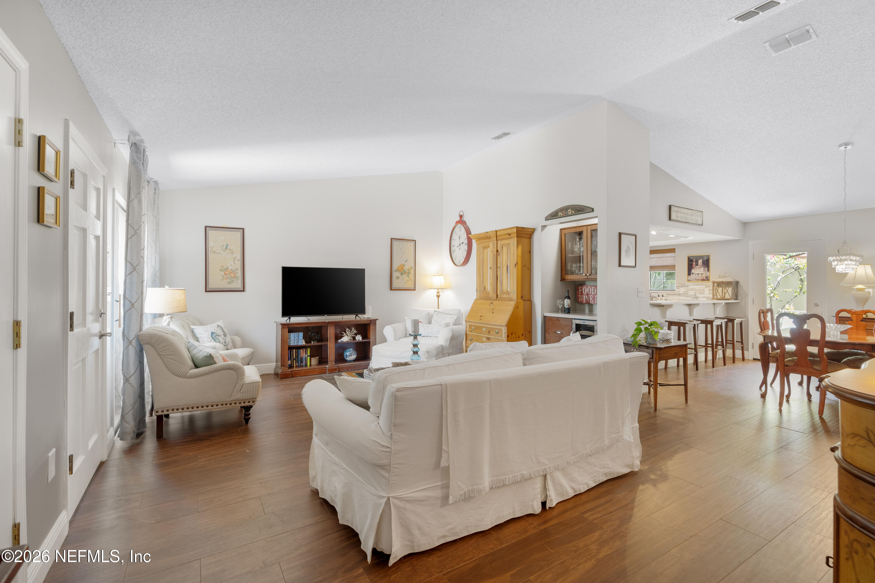 204 Gerado Street, Unit 3 St. Augustine, FL 32080 - Photo 6 of 31 a living room with furniture and a flat screen tv