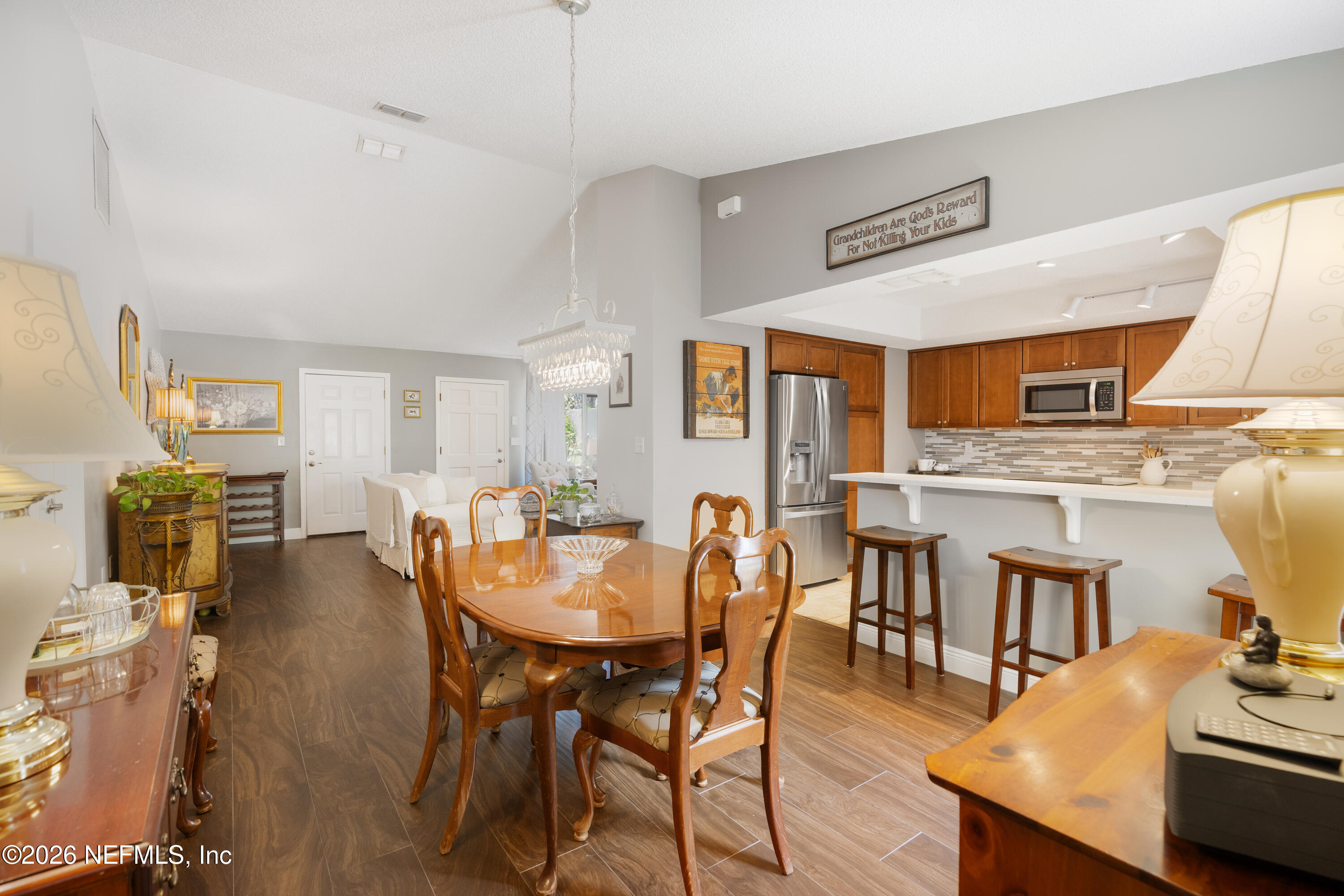 204 Gerado Street, Unit 3 St. Augustine, FL 32080 - Photo 8 of 31 a dining room with furniture entryway and wooden floor