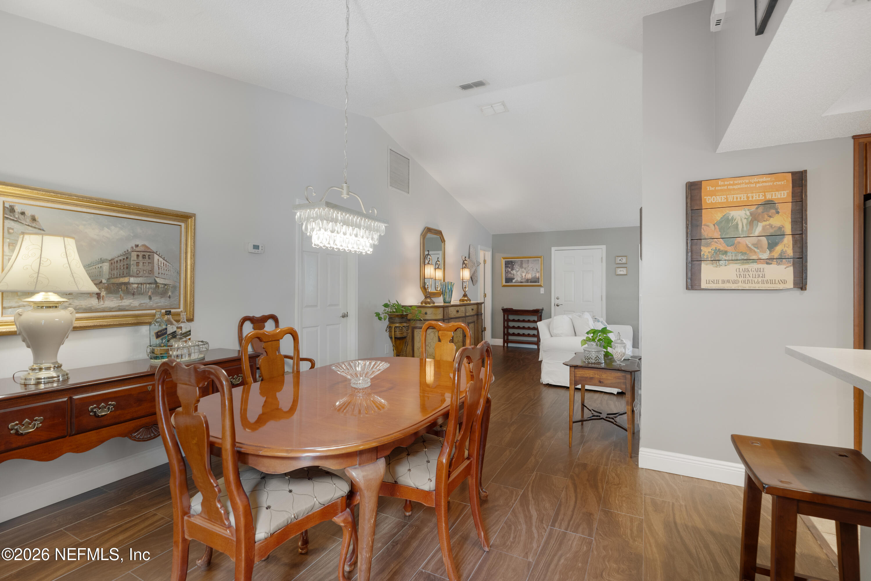204 Gerado Street, Unit 3 St. Augustine, FL 32080 - Photo 9 of 31 a view of a dining room with furniture and wooden floor