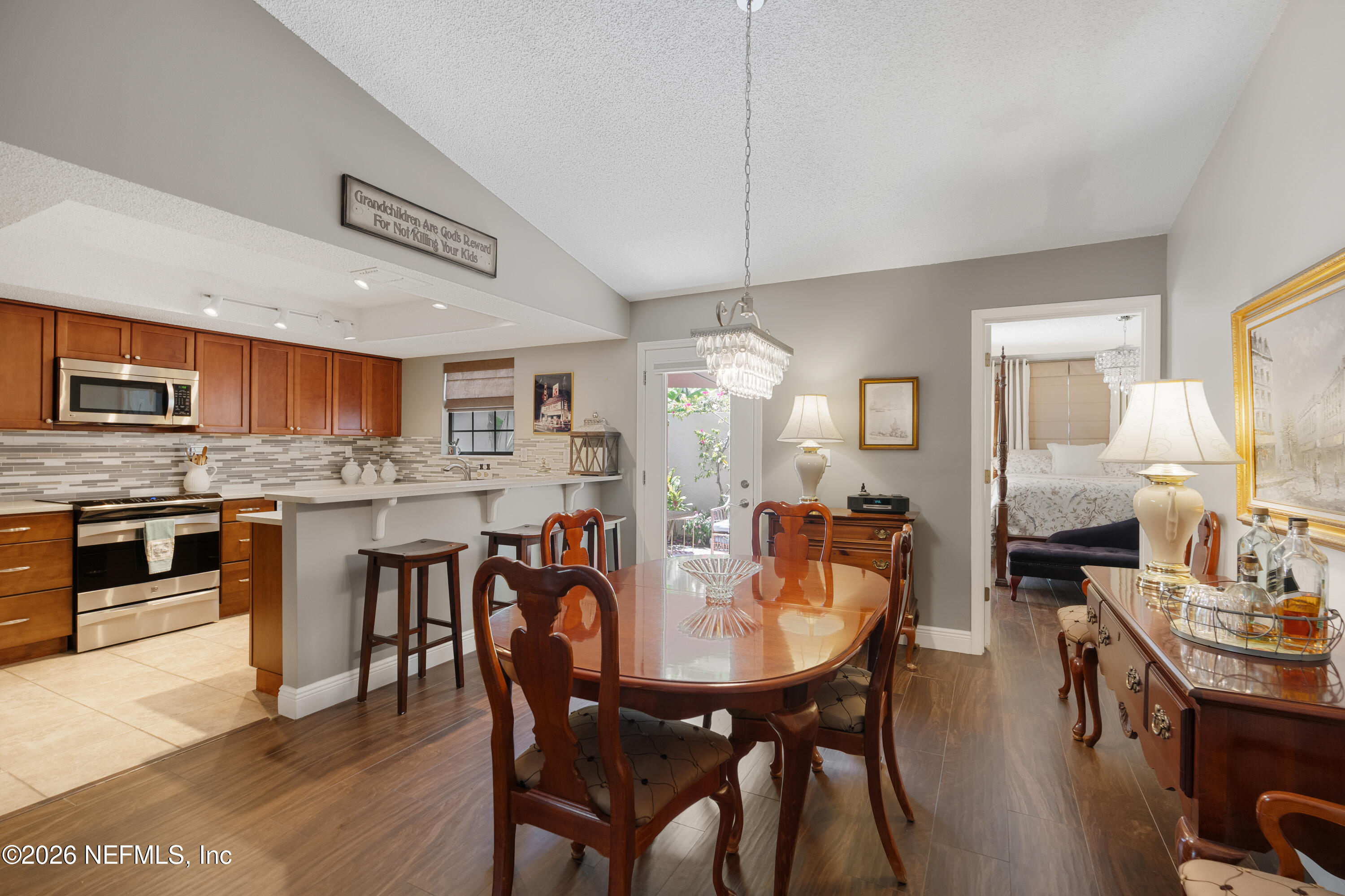 204 Gerado Street, Unit 3 St. Augustine, FL 32080 - Photo 10 of 31 a large kitchen with a table and chairs