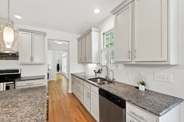a bathroom with a shower curtain and a walk in closet