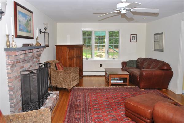 352 Liberty Square Road Boxborough, MA 01719 - Photo 11 of 16 a living room with furniture and a fireplace