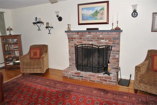 352 Liberty Square Road Boxborough, MA 01719 - Photo 12 of 16 a living room with furniture and a fireplace