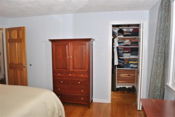 352 Liberty Square Road Boxborough, MA 01719 - Photo 15 of 16 a bedroom with a wooden floor and closet