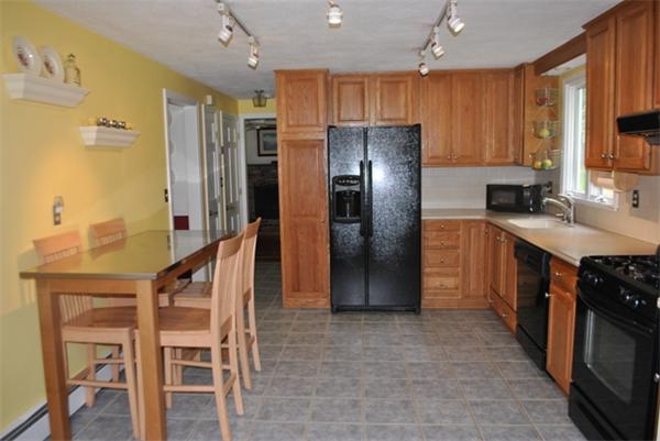 352 Liberty Square Road Boxborough, MA 01719 - Photo 5 of 16 a kitchen with granite countertop a refrigerator and a sink