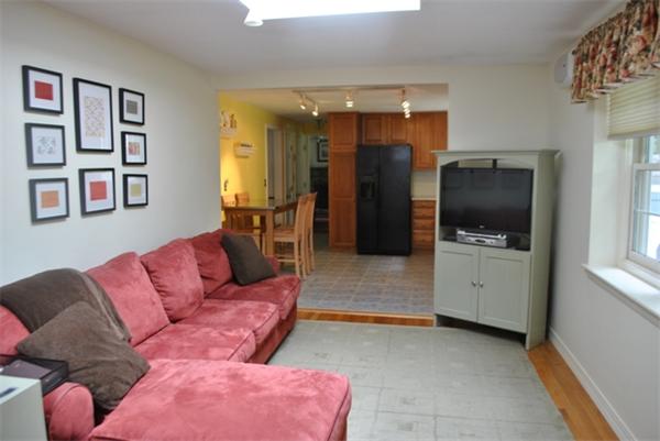 352 Liberty Square Road Boxborough, MA 01719 - Photo 6 of 16 a living room with furniture and a flat screen tv