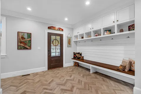 a view of an entryway with wooden floor