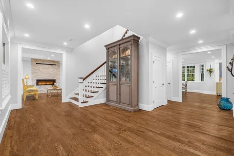 a view of an entryway with wooden floor