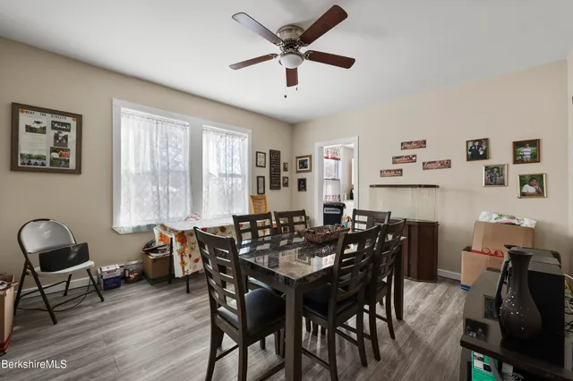 a dining room with furniture and window