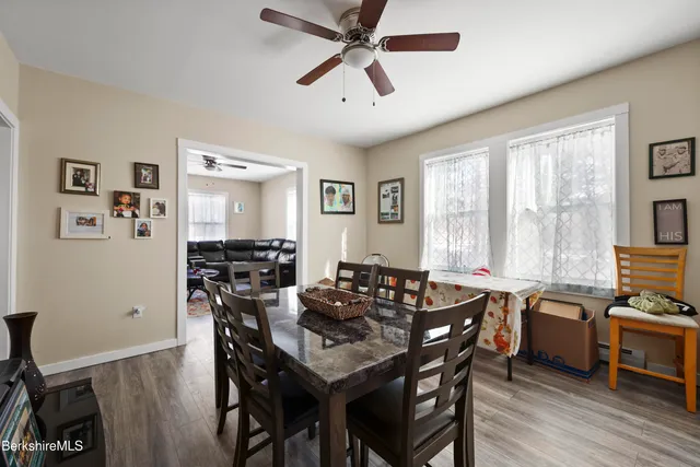a view of a dining room with furniture and a window