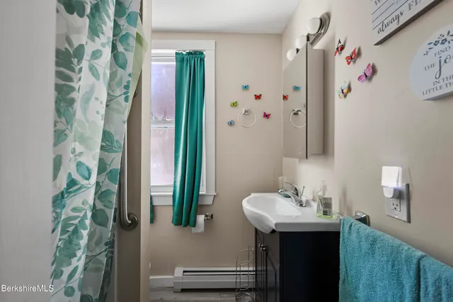 a bathroom with a sink and mirror