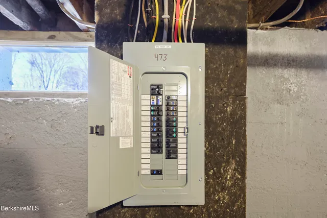 a close view of a bathroom with a shower and a window