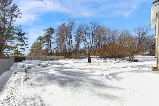 a view of snow on a road