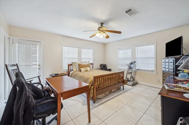 a view of a livingroom with furniture and a flat screen tv