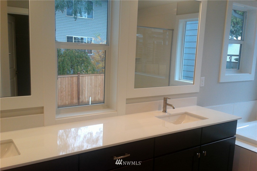 4323 223rd Place Southeast Bothell, WA 98021 - Photo 11 of 15 a bathroom with a sink and a mirror