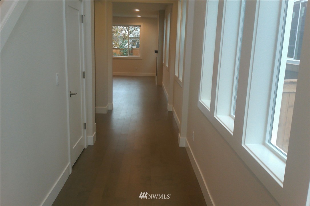 4323 223rd Place Southeast Bothell, WA 98021 - Photo 8 of 15 a view of a hallway with wooden floor