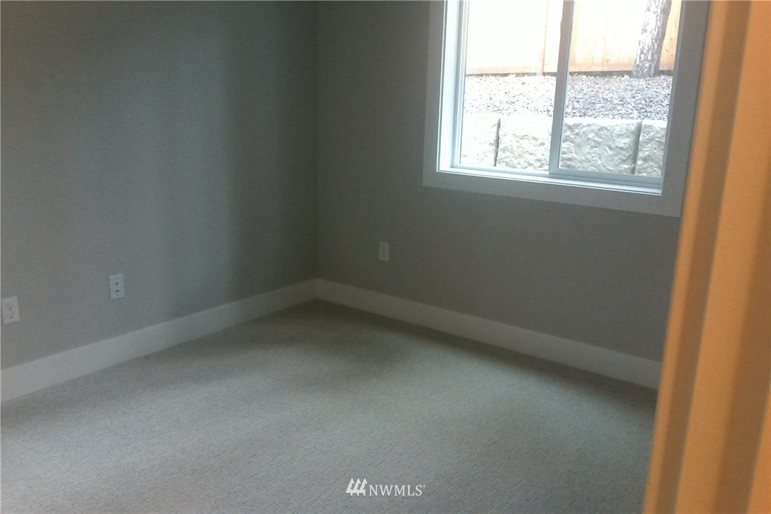 4323 223rd Place Southeast Bothell, WA 98021 - Photo 9 of 15 an empty room with a window