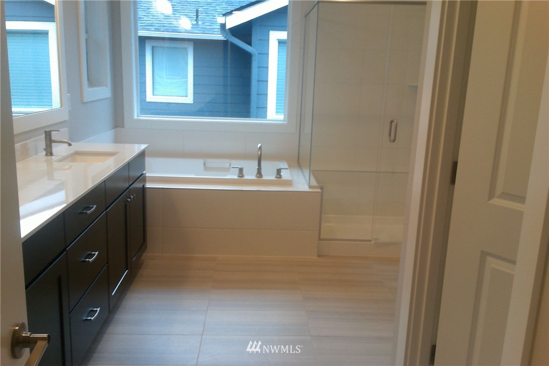 4323 223rd Place Southeast Bothell, WA 98021 - Photo 10 of 15 a bathroom with a sink and a mirror
