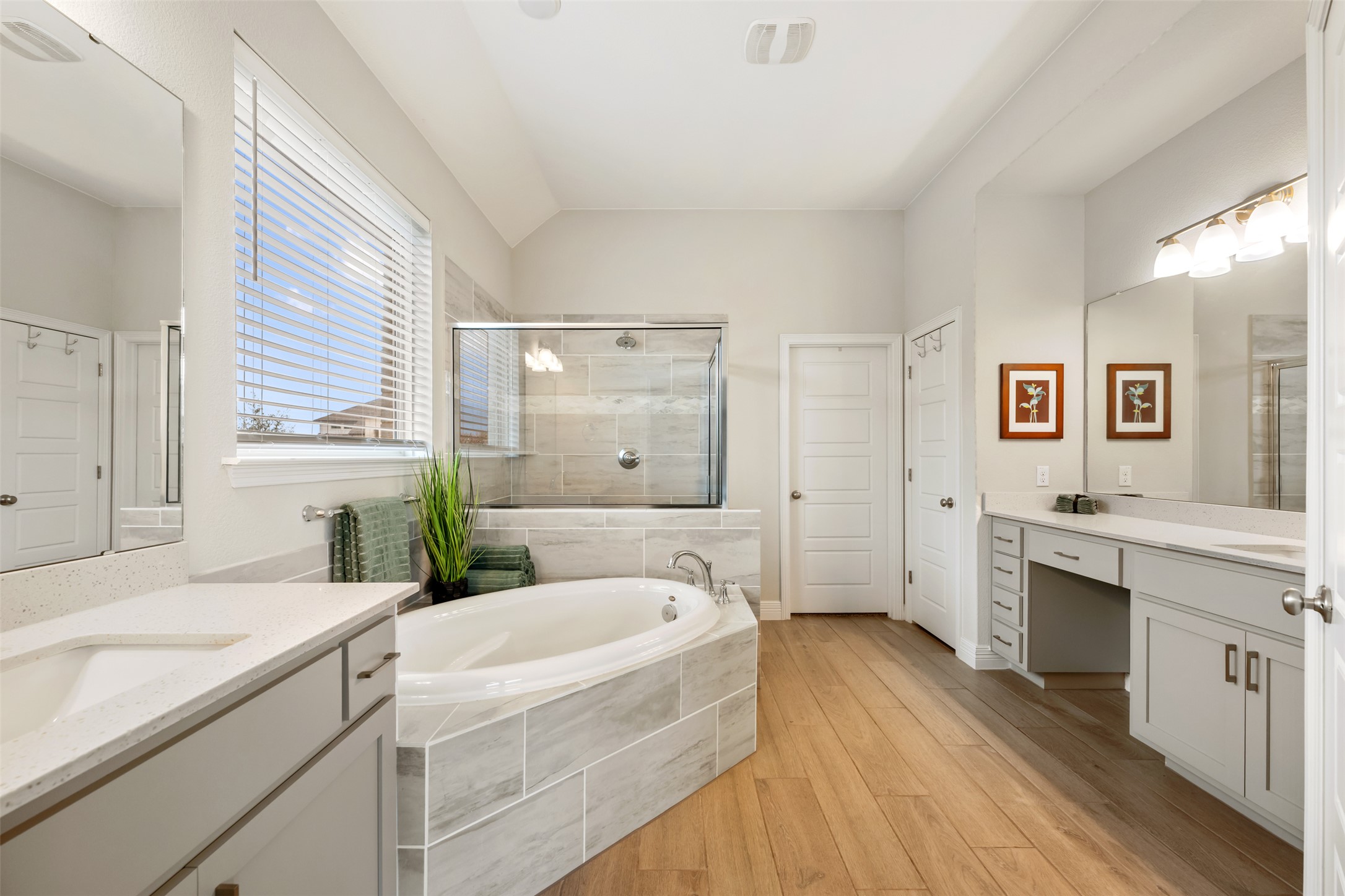 2501 Costera Street Leander, TX 78641 - Photo 15 of 40 Master suite bath with soaking tub, shower and two vanities.