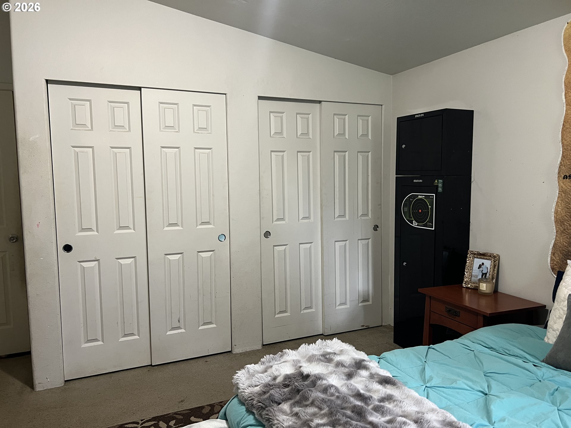 210 Northwest Grinstead Street Siletz, OR 97380 - Photo 15 of 29 a bedroom with a bed and a closet