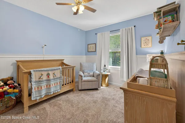 a bedroom with furniture and a window