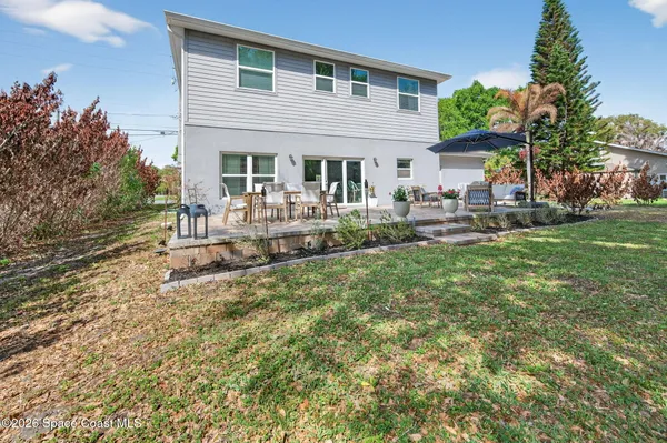 a front view of house with yard and seating area
