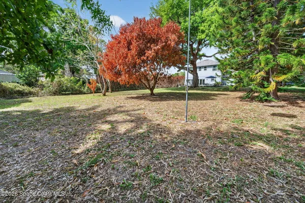 a backyard of a house with lots of green space