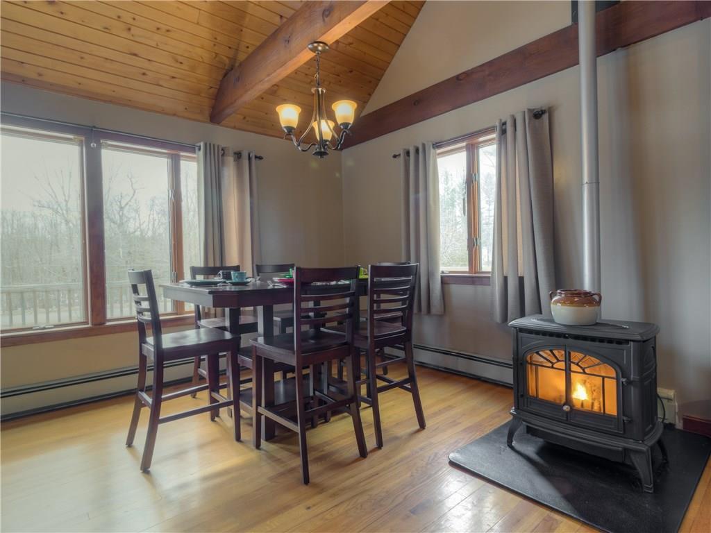 182 Church Road New Gloucester, ME 04260 - Photo 7 of 32 Dining area with wood stove