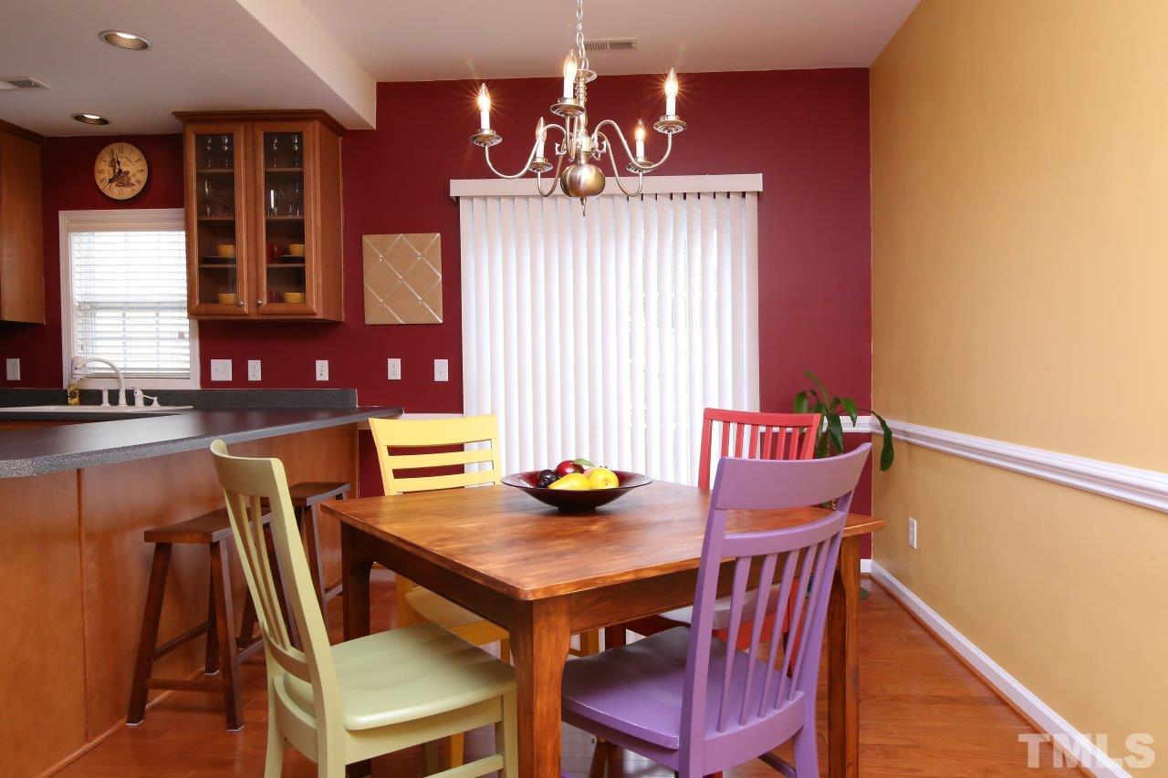 2110 Piney Brook Road, Unit 102 Raleigh, NC 27614 - Photo 12 of 24 The door beyond the breakfast area leads to the private patio area.
