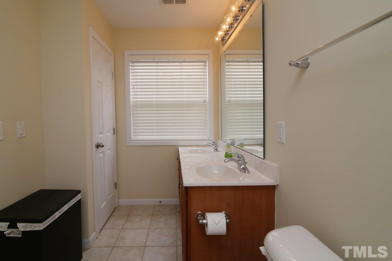 2110 Piney Brook Road, Unit 102 Raleigh, NC 27614 - Photo 15 of 24 The master bath has a double vanity and a linen closet.