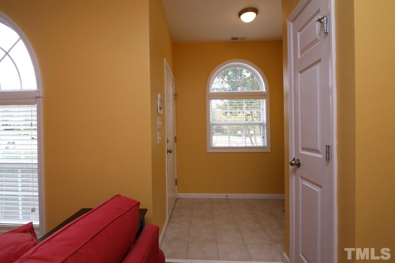 2110 Piney Brook Road, Unit 102 Raleigh, NC 27614 - Photo 3 of 24 There's an entry foyer that leads to the living room.
