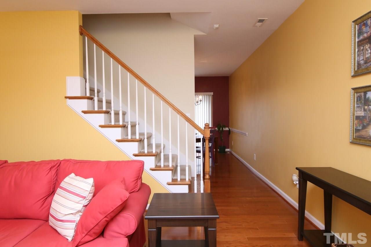 2110 Piney Brook Road, Unit 102 Raleigh, NC 27614 - Photo 6 of 24 The stairs are between the living room and the breakfast/kitchen area.