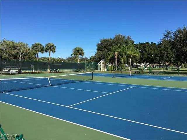 a view of an outdoor space and tennis court