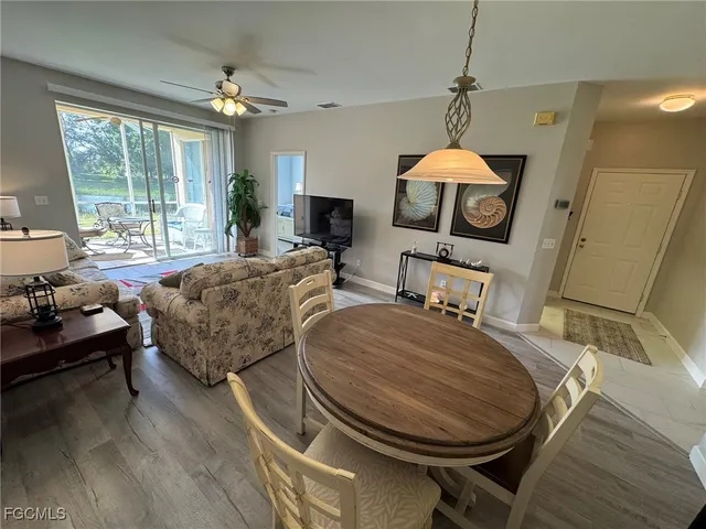a living room with furniture and a table