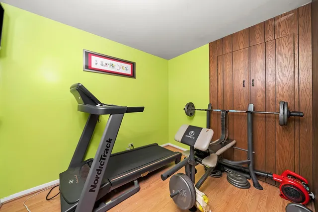 a room with furniture and gym equipment