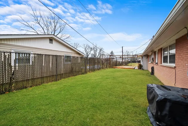 a backyard of a house with lots of green space