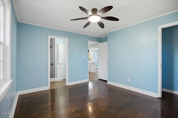 a view of wooden floor and windows in a room