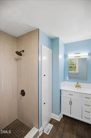 a bathroom with a sink and mirror