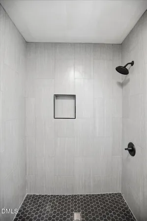 a bathroom with a sink a light fixture and a toilet