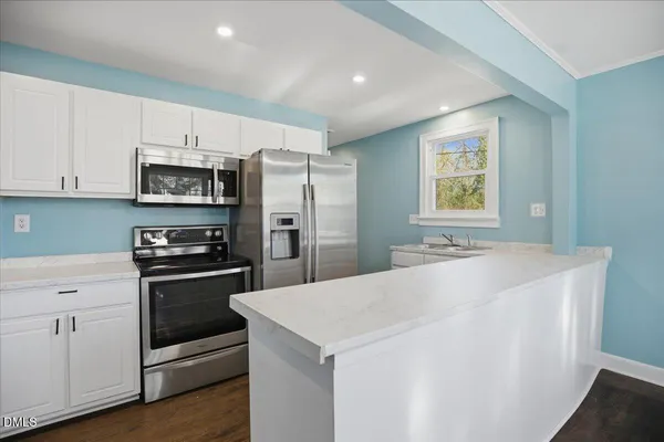 a view of a kitchen with a sink and dishwasher kitchen view