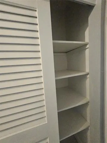 a kitchen with a refrigerator and a sink