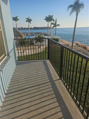 a view of balcony with wooden floor