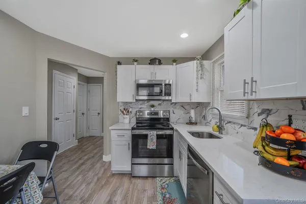 $559,000 | 67 Pentmoor Drive, Mastic, NY 11950