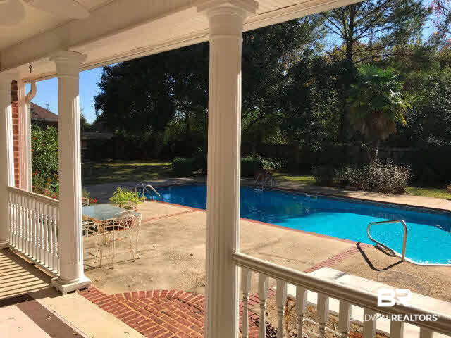 401 Potters Mills Road Daphne, AL 36526 - Photo 25 of 28 For Sale: 401 Potters Mill Avenue, Daphne, AL 36526 covered back porch overlooking pool