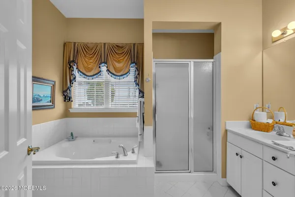 a bathroom with a bathtub and a sink