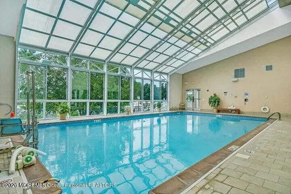 a view of a living room and floor to ceiling window